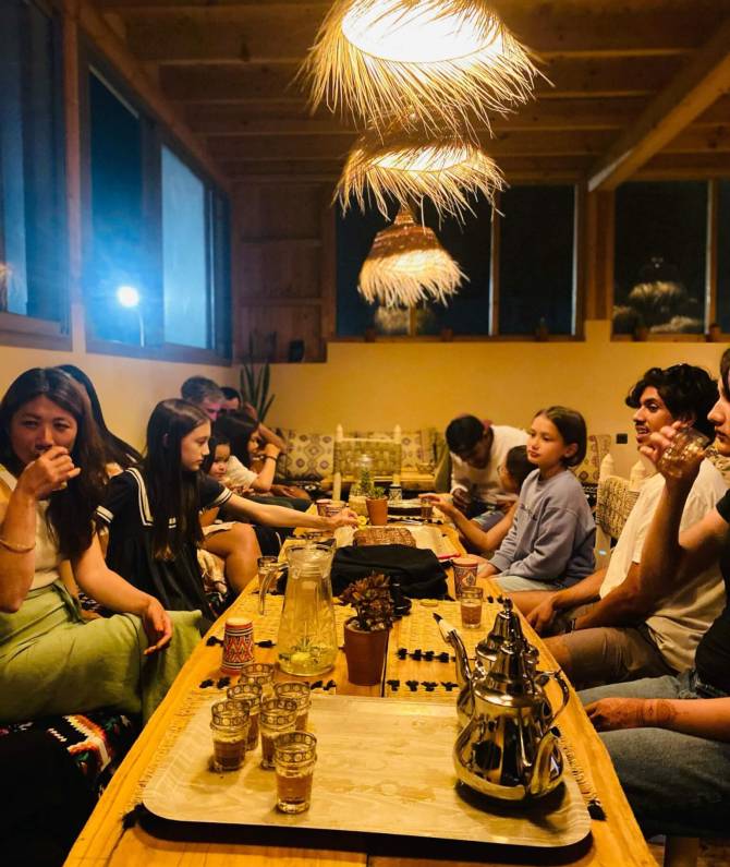 our surfers and students after surf session enjoyin rooftop in imsouane surf family the best surf camp with surf vibe